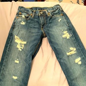 Young men’s distressed Levi’s 511 jeans. W 29, L 32